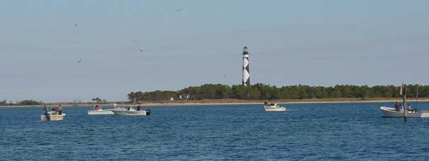 Man and false albacore meet
under the light at Cape Lookout. Photo: Jeff Sayre